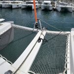 Excess 12 catamaran forward trampoline with panoramic Caribbean sea views