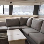 Fountaine Pajot Saba 50 catamaran saloon with panoramic windows, lounge and dining area
