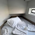 Lagoon 40 forward cabin with double bed and panoramic hull windows