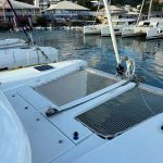 Lagoon 40 catamaran forward trampoline with panoramic Caribbean sea views