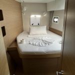 Lagoon 42 forward cabin with double bed and panoramic hull windows