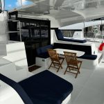 Lagoon 42 catamaran cockpit with spacious outdoor dining and lounge area