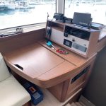 Lagoon 42 catamaran navigation station with chart table and navigation controls