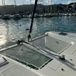 Lagoon 42 forward trampoline with panoramic Caribbean sea views
