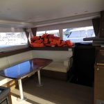 Bright Lagoon 450 catamaran saloon with panoramic windows and elegant lounge area for Caribbean cruising