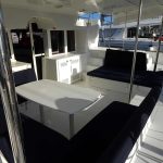 Spacious Lagoon 450 catamaran cockpit with outdoor dining area during a Caribbean yacht charter