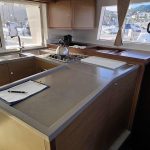 Fully equipped galley aboard the Lagoon 450 catamaran with spacious worktops and storage