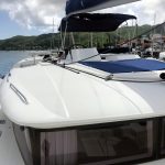 Lagoon 450 catamaran flybridge with seating area and panoramic views over the Caribbean