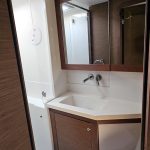 Lagoon 450 catamaran bathroom with shower, washbasin and marine toilet