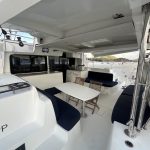 Lagoon 46 catamaran cockpit with outdoor dining area and direct access to the saloon