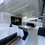 Lagoon 50 catamaran cockpit with outdoor dining area and direct access to the saloon