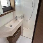 Lagoon 50 catamaran bathroom with shower, washbasin and marine toilet