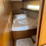 Jeanneau Sun Odyssey 440 guest cabin with double berth, storage and natural light