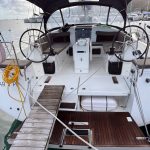 Jeanneau Sun Odyssey 440 sailing yacht docked at the marina with stern access platform