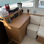 Excess 14 catamaran navigation station with chart table and navigation controls
