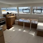 Excess 14 catamaran saloon with panoramic windows and modern interior