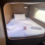 Bright forward cabin aboard the Lagoon 380 catamaran with comfortable double berth