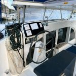 Helm station of the Lagoon 380 catamaran with panoramic visibility and sailing controls